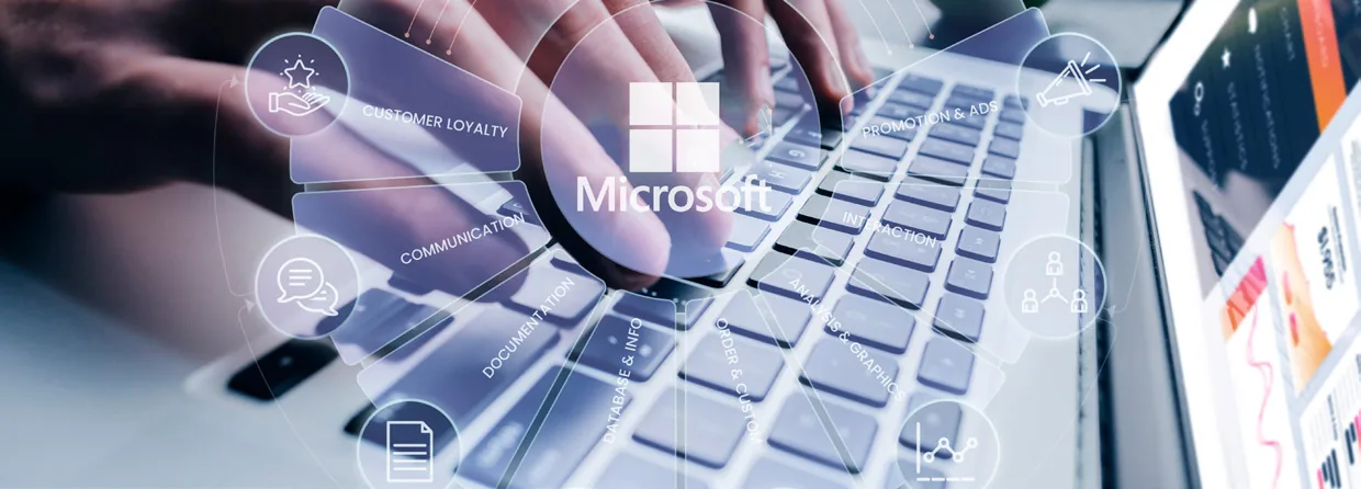 Microsoft business applications interface overlaid on a laptop keyboard